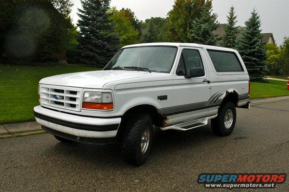 White 1994 Ford Bronco parked on a residential street