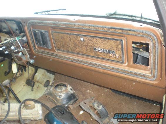Interior dashboard with wood grain trim and "RANGER XLT" badge