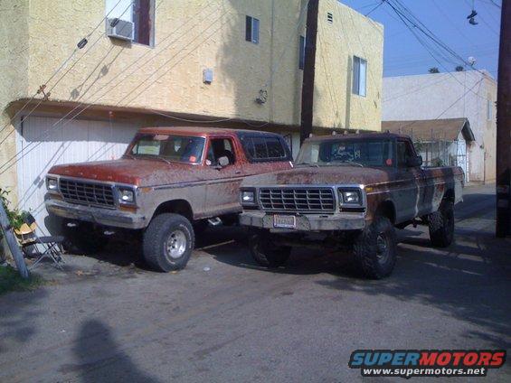 Red Ford Bronco and brown Ford F-250 parked side-by-side, both lifted