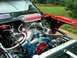 1984 Ford Bronco - Custom V8 engine with a UNI air filter and performance parts, viewed from the engine bay.