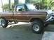 1976 Ford F-250 - This lifted brown Ford F-250 pickup truck displays a body style consistent with the early to mid-1970s.