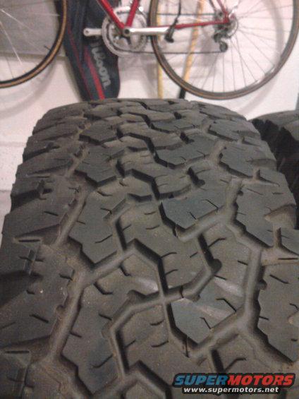 Tire tread with aggressive block pattern, close-up view