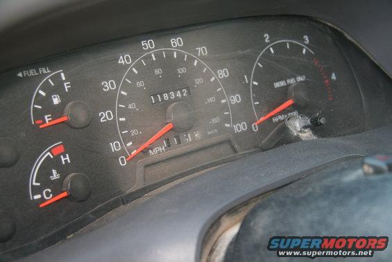 Dashboard gauges with odometer reading 118342, fuel and temperature gauges, and a diesel tachometer