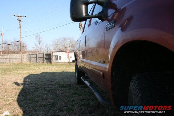 Red truck side view with F350 badge visible