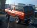 1978 Ford Bronco - This lifted 1978 Ford Bronco is shown from a rear-three-quarter angle under a bright sky.