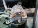 1994 Ford F-250 - A close-up view of a vehicle's starter motor solenoid, showing electrical connections and mounting hardware.
