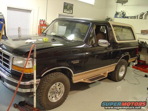 Black 1995 Ford Bronco with tan trim and running boards