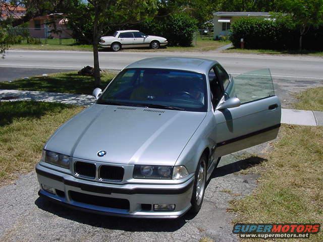 Silver 1995 BMW M3 coupe, driver's door open