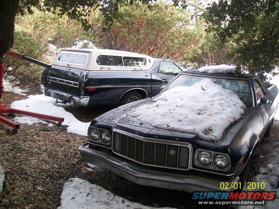 Two Ford Rancheros parked outside in the snow, one with a camper shell