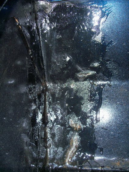 1978 Jeep CJ5 undercoating with visible fabric reinforcement and dripping tar-like substance