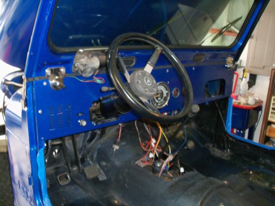 1978 Jeep CJ5 interior showing dashboard, steering wheel, and exposed wiring