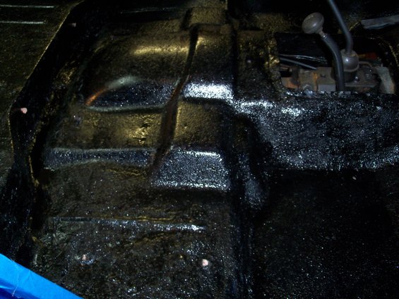 Jeep interior floor with black textured coating and shifter