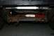 1979 Ford Bronco - The rear suspension and frame of a vehicle are visible, showing signs of rust and wear.