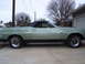 1973 Ford Ranchero - This light green 1972 Ford Ranchero pickup truck is shown from the side, a black vinyl roof and aftermarket wheels.