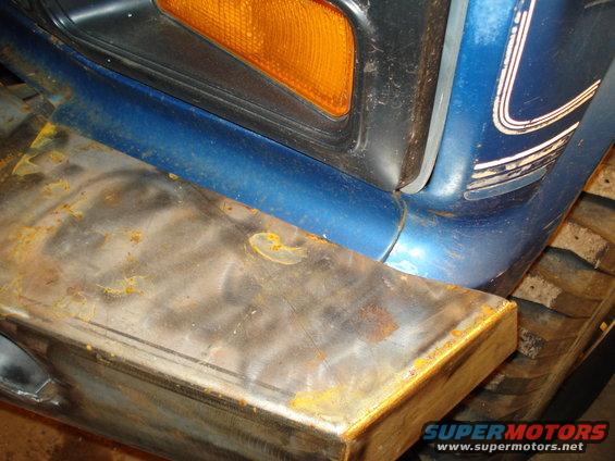 1985 Ford F-150 front corner with custom steel bumper and amber turn signal