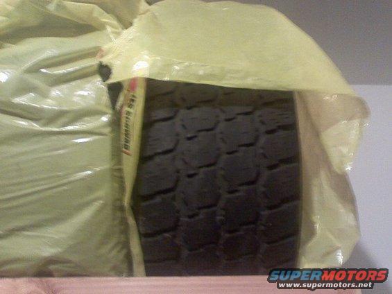 Tire tread with yellow protective wrap