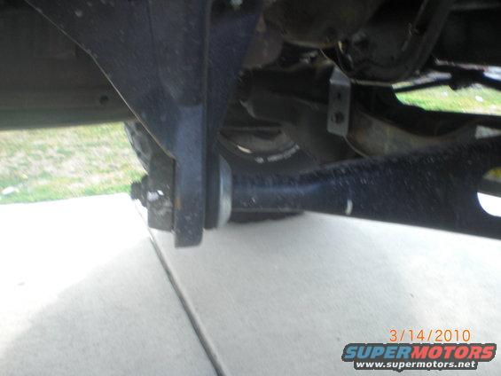 Underbody suspension components with a date stamp and SuperMotors logo