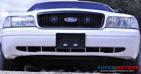 White 2002 Ford Crown Victoria front grille with honeycomb pattern