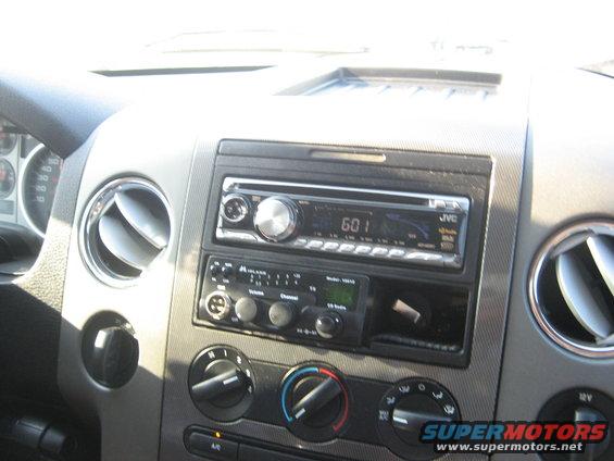 Interior dashboard with JVC and Midland radios, air vents, and climate controls
