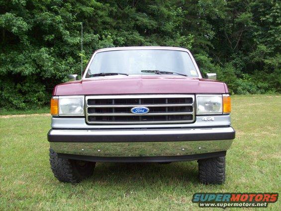 Maroon 1990 Ford F-150 front view with chrome bumper and grille