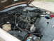 1993 Ford Crown Victoria - The engine bay of a 1993 Ford Crown Victoria, equipped with a supercharger, is viewed from above.