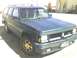 1993 Oldsmobile Bravada - This 1995 GMC Jimmy SUV is seen from the front 3/4 angle, parked outside.