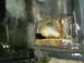 1993 Ford Bronco - The interior floor of a vehicle shows extensive rust damage and structural compromise.