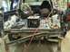 1993 Ford Bronco - The interior and cargo area of a truck, showing tools and a milk crate, with visible rust and damage.
