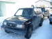 1993 Suzuki Sidekick - This 1993 Suzuki Sidekick is equipped with a snorkel and a roof rack, ready for winter conditions.