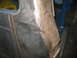 1977 Ford F-150 - This photo shows a section of a truck's body panel undergoing repair, revealing rust and damage.