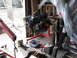 1977 Ford F-150 - An engine is mounted on a stand in a cluttered garage environment.