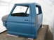 1977 Ford F-150 - This 1977 Ford F-150 cab and bed is shown in a tent, likely undergoing restoration or preparation for paint.