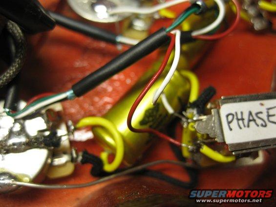 Close-up of internal wiring with a switch labeled PHASE