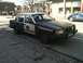 1998 Ford Crown Victoria - This Volvo 740/760 sedan is modified to resemble a police vehicle, complete with markings and a push bar.