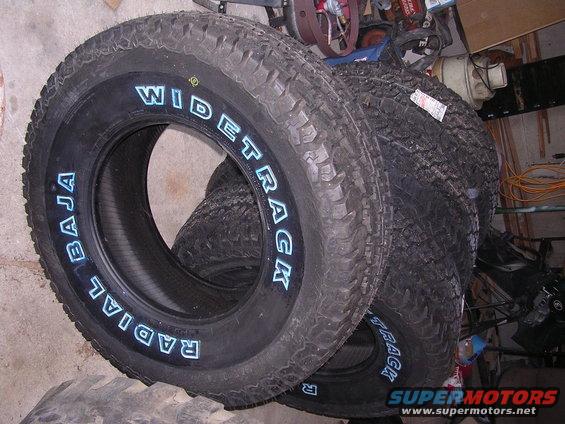 Tires with white lettering reading "BAJA RADIAL" and "WIDETRACK"