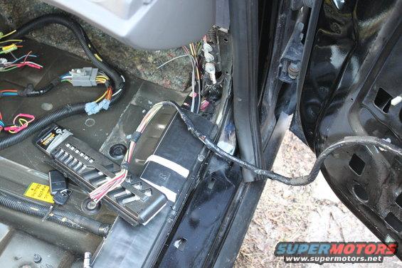 img_1118.jpg powerseat wires are installed to the end of the wiring runner with enought sticking out to make another connection to the door wiring, that is being installed in this picture.