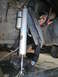 1984 Ford Bronco II - Vehicle suspension detail showing a shock absorber and related hardware.