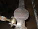 1997 Ford Ranger - Metal disc with crosshair marking being welded onto a pipe, part of a mechanical assembly.