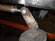 1997 Ford Ranger - Detail of a vehicle's undercarriage, showing a suspension part and mounting hardware.