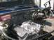 1979 Chevrolet C/K Pickup - Custom V8 engine installation in a vehicle's engine bay, aftermarket parts.