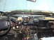 1994 Ford Bronco - The dashboard of a 1992 Ford Bronco is shown with its interior components and wiring exposed.