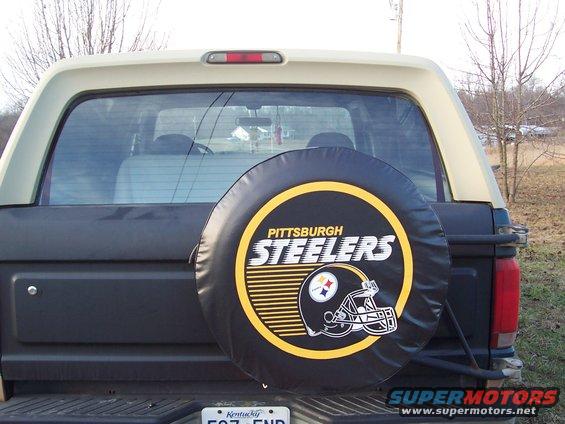 Rear view of a 1984 Ford Bronco with a Pittsburgh Steelers spare tire cover