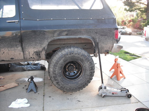 1991 Ford Bronco side view, rear wheel off, on jack stands