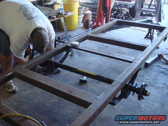 dsc05722.jpg Ben bolts on the axle