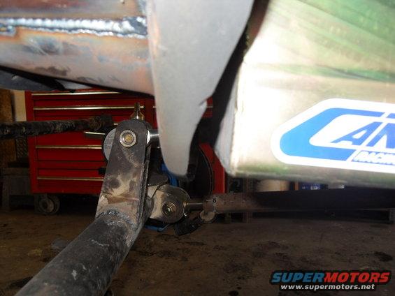 Close-up of a metal suspension component with a blue and white 'AIR' sticker on a silver box