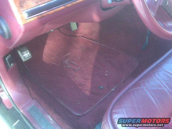 1993 Lincoln Town Car interior with maroon carpet and leather seats