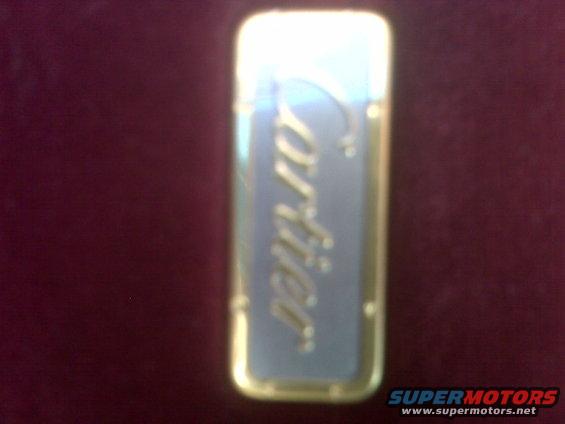 gold and blue Cartier lighter