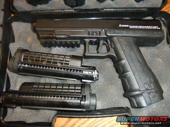 Black paintball gun with two magazines in a case