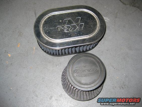 K&N air filter next to a smaller air filter with a black cap