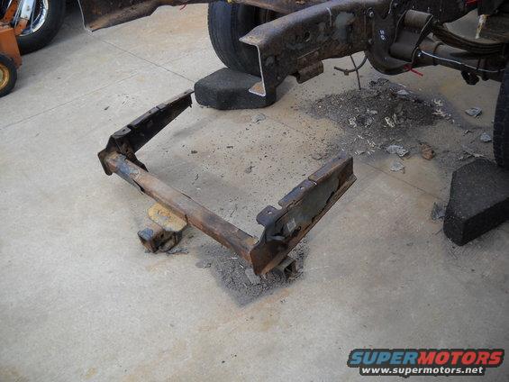 54-build--33010-017.jpg Today I started out but trying to break loose the bolts holding the receiver hitch to the frame section I cut off.  After a lot of failed attempts and some words I won't repeat here. I decided to just cut the bolts with my small 4" grinder with a cut off wheel. That did the job and I was able to remove the hitch.